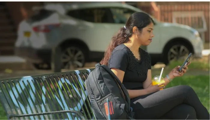 Girl sat on bench